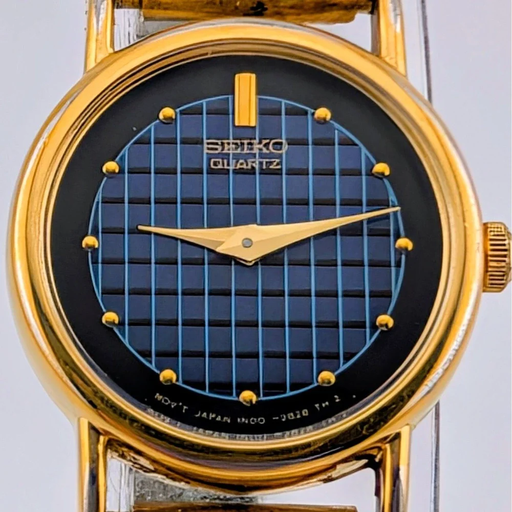 Vintage Seiko 1N00-0F60 Blue Woven Grid Textured Dial Gold Tone Watch 20mm